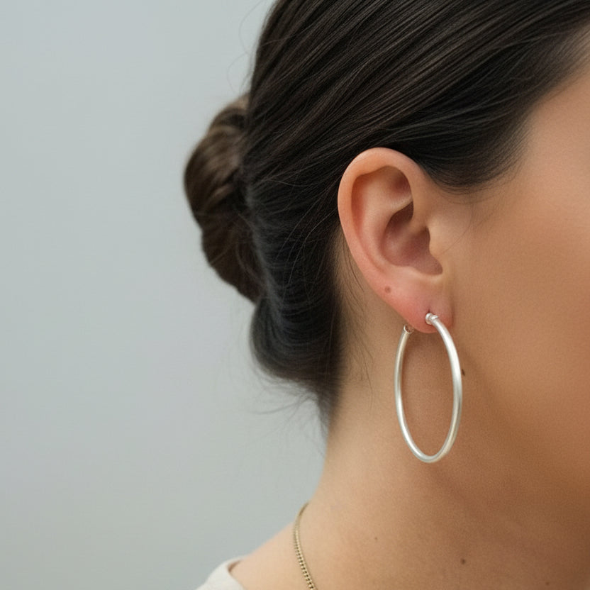 Large 2-inch matte silver round tube hoop earrings with hinged click closure | The Pretty Pistol