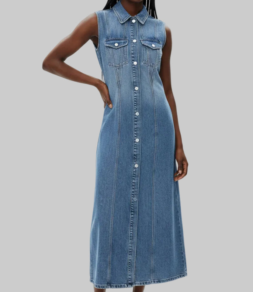 Sleeveless medium blue wash denim maxi dress with full snap-button front, dual chest flap pockets with decorative stitching, fitted silhouette, and front slit, styled with cowboy boots | The Pretty Pistol