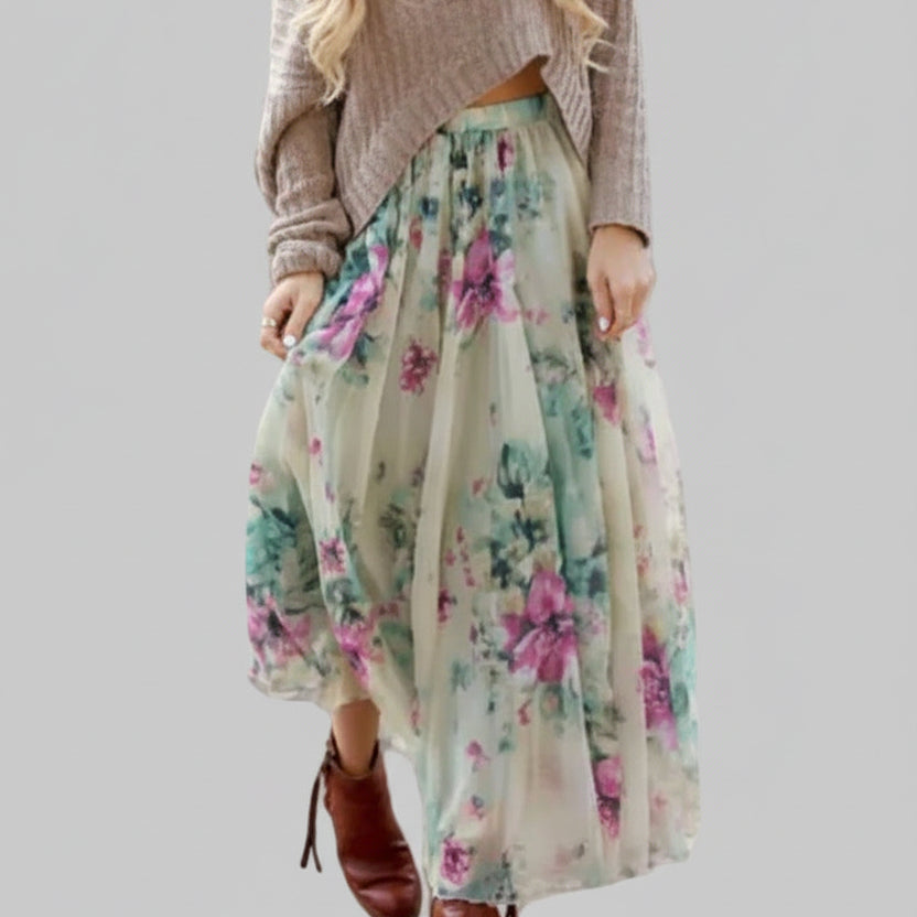 Flowy watercolor floral chiffon maxi skirt in teal, purple and green tones with wide elastic waist and gathered silhouette, styled with a cropped knit sweater and brown ankle boots | The Pretty Pistol