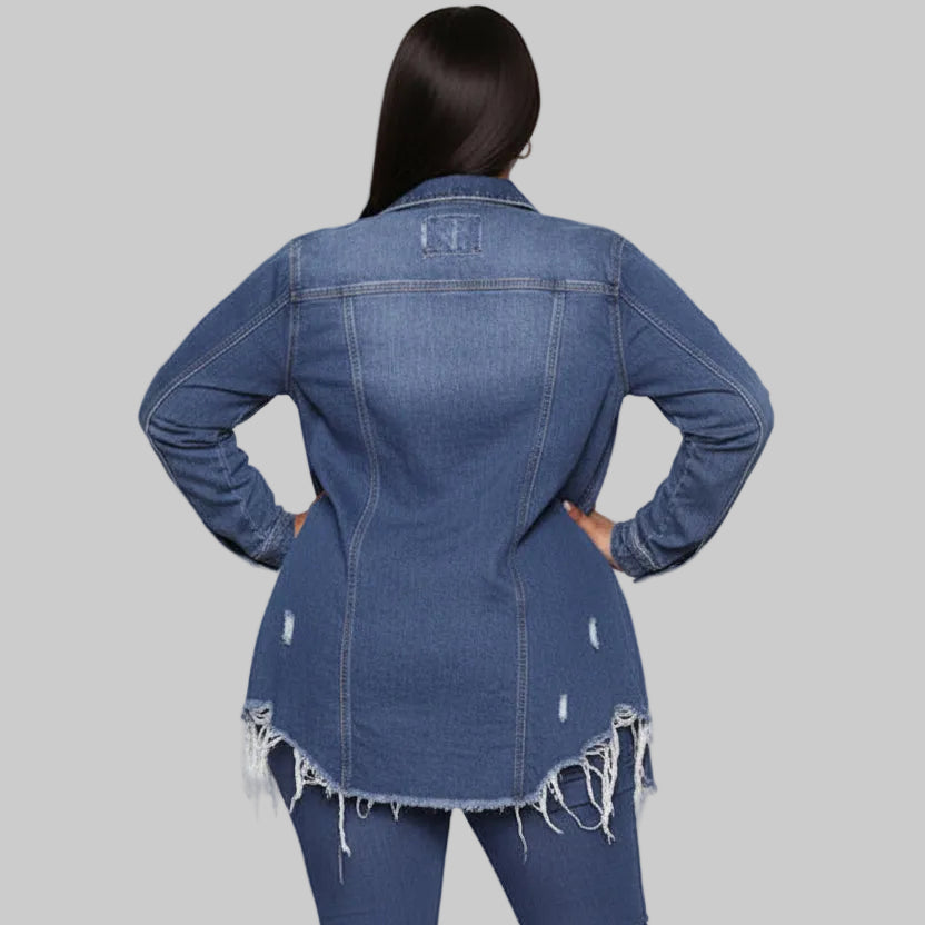 Plus size dark blue ripped denim shacket with spread collar, dual chest pockets, and raw frayed longline hem worn open over a white tank | The Pretty Pistol
