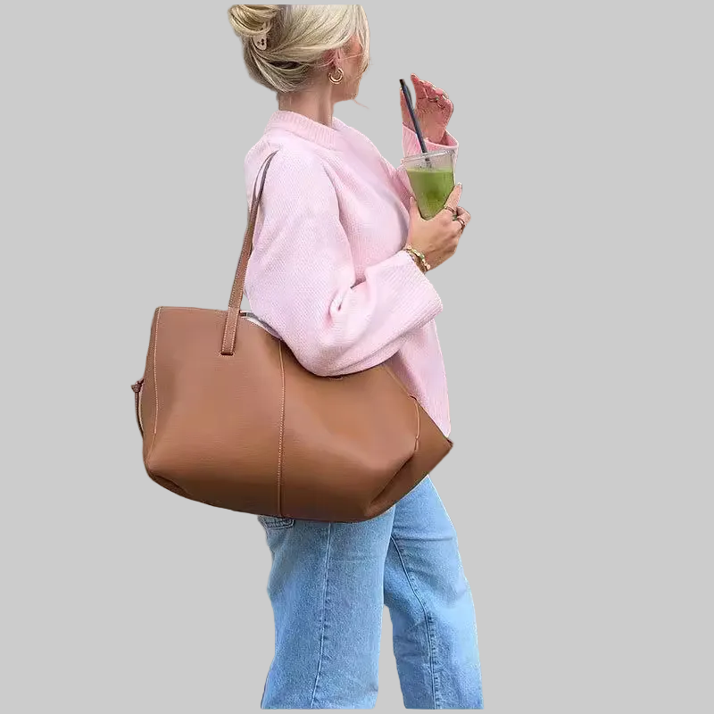Pastel pink oversized chunky knit mock-neck sweater with balloon sleeves and ribbed cuffs, styled with light wash jeans and a tan leather bag | The Pretty Pistol