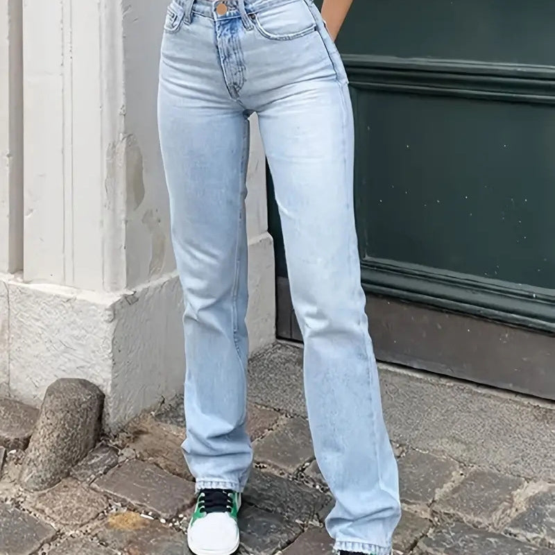 Women's high-rise wide leg jeans in ice blue light wash worn with a crop top and sneakers | The Pretty Pistol