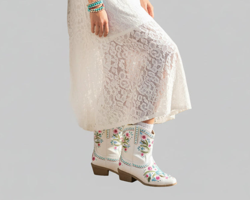 White floral embroidered cowgirl boots with pink and teal flower stitching, square toe, and stacked block heel | The Pretty Pistol