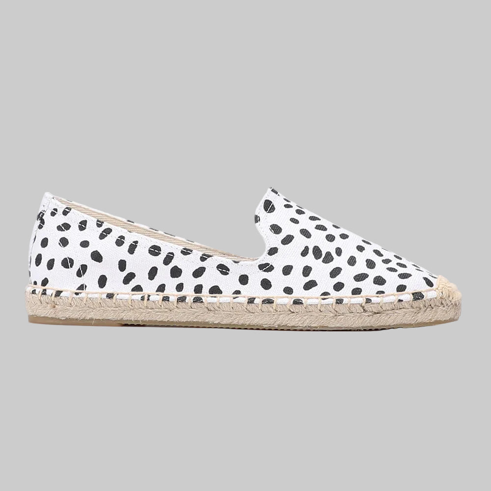 White canvas espadrille slip-on flats with all-over black dalmatian spot print and braided jute rope sole | The Pretty Pistol