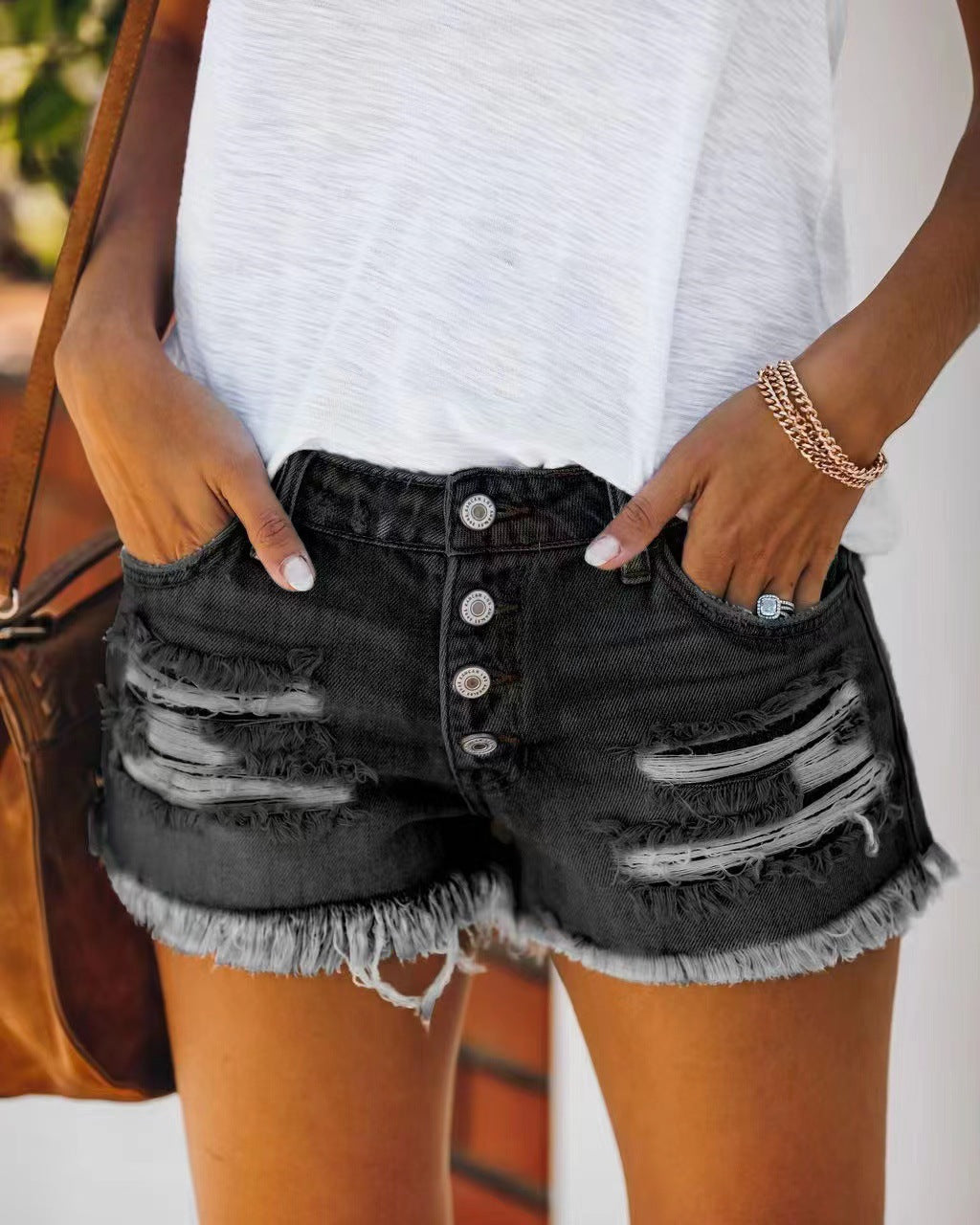 Women's button-fly ripped denim shorts in black with frayed hem | The Pretty Pistol
