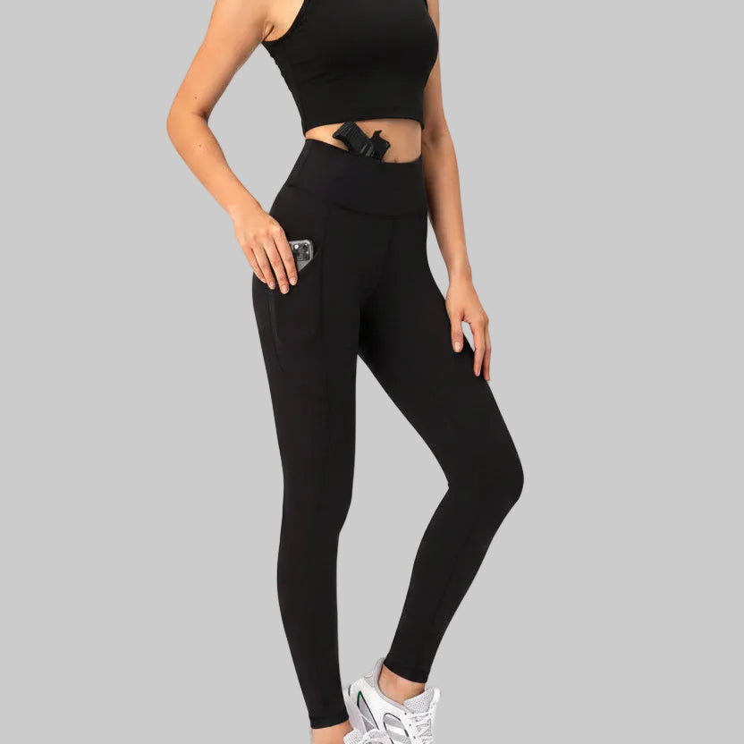 Black high-rise women's concealed carry compression leggings with side phone pocket and built-in waistband holster, shown with pistol and phone inset | The Pretty Pistol