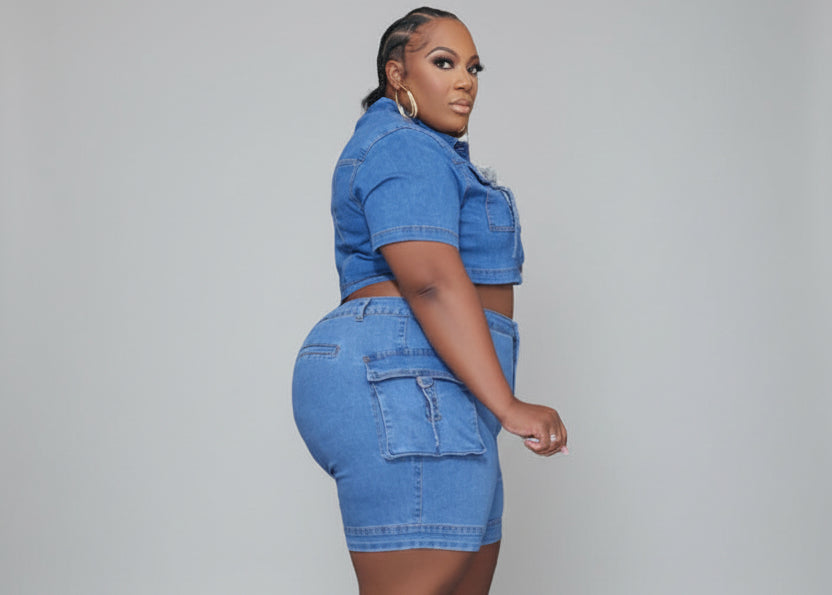 Plus size medium-wash denim two piece set with cropped button top and cargo biker shorts | The Pretty Pistol