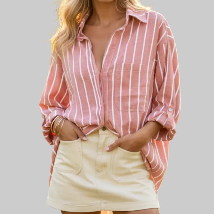 Pink and white vertical striped button-down oversized shirt with point collar, chest pocket, and long roll-tab sleeves | The Pretty Pistol