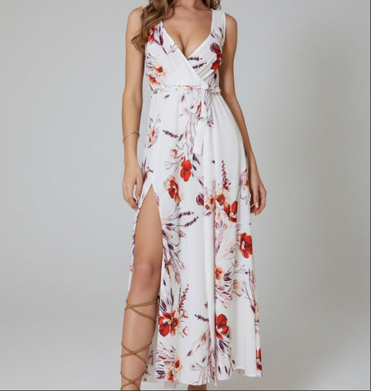 White and red botanical floral wrap maxi dress with deep V-neckline, self-tie waist, and high front slit in flowy chiffon-style fabric, styled with strappy sandals | The Pretty Pistol