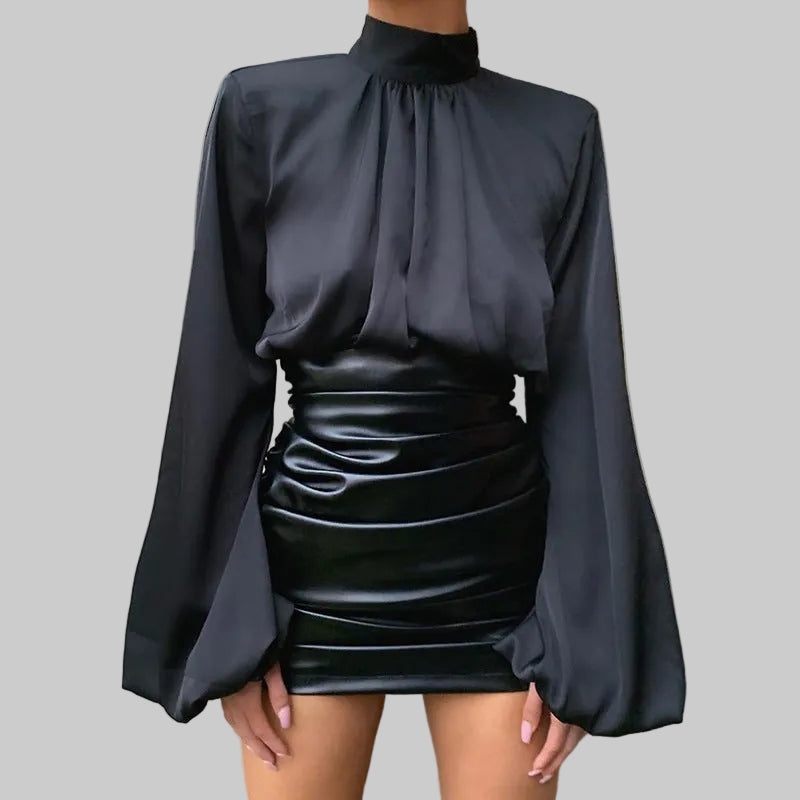 Black satin mock-neck lantern sleeve crop blouse with gathered neckline and puff sleeves, styled with faux leather mini skirt | The Pretty Pistol