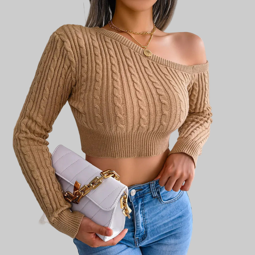 Khaki off-shoulder cable knit crop sweater with long sleeves and waist-hugging fit, styled with blue jeans and white bag | The Pretty Pistol