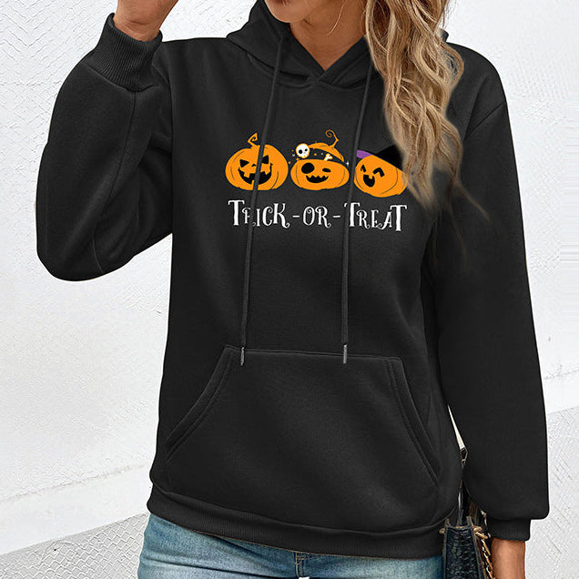 Black Halloween hoodie with three pumpkin Trick-or-Treat graphic on chest, pullover style with ribbed cuffs and kangaroo pocket | The Pretty Pistol
